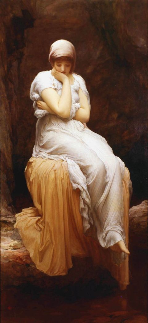 Painting. A pale-skinned soman sits holding her chin one hand and the other wrapped across her torso. In front of a stone wall, her feet, crossed at the ankle, dangle down, possibly over a reflective pool. She wears a white flowing dress and sits on an apricot-orange cloth.
