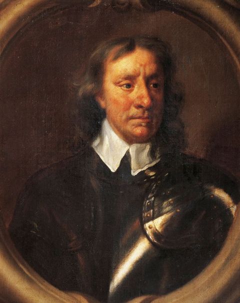 Painting. In an oval frame, a pale-skinned man wearing armour looks off to our right. His brown hair feathers away from his face, which is marked with red splotches. A high white collar folds over a silver breastplate.